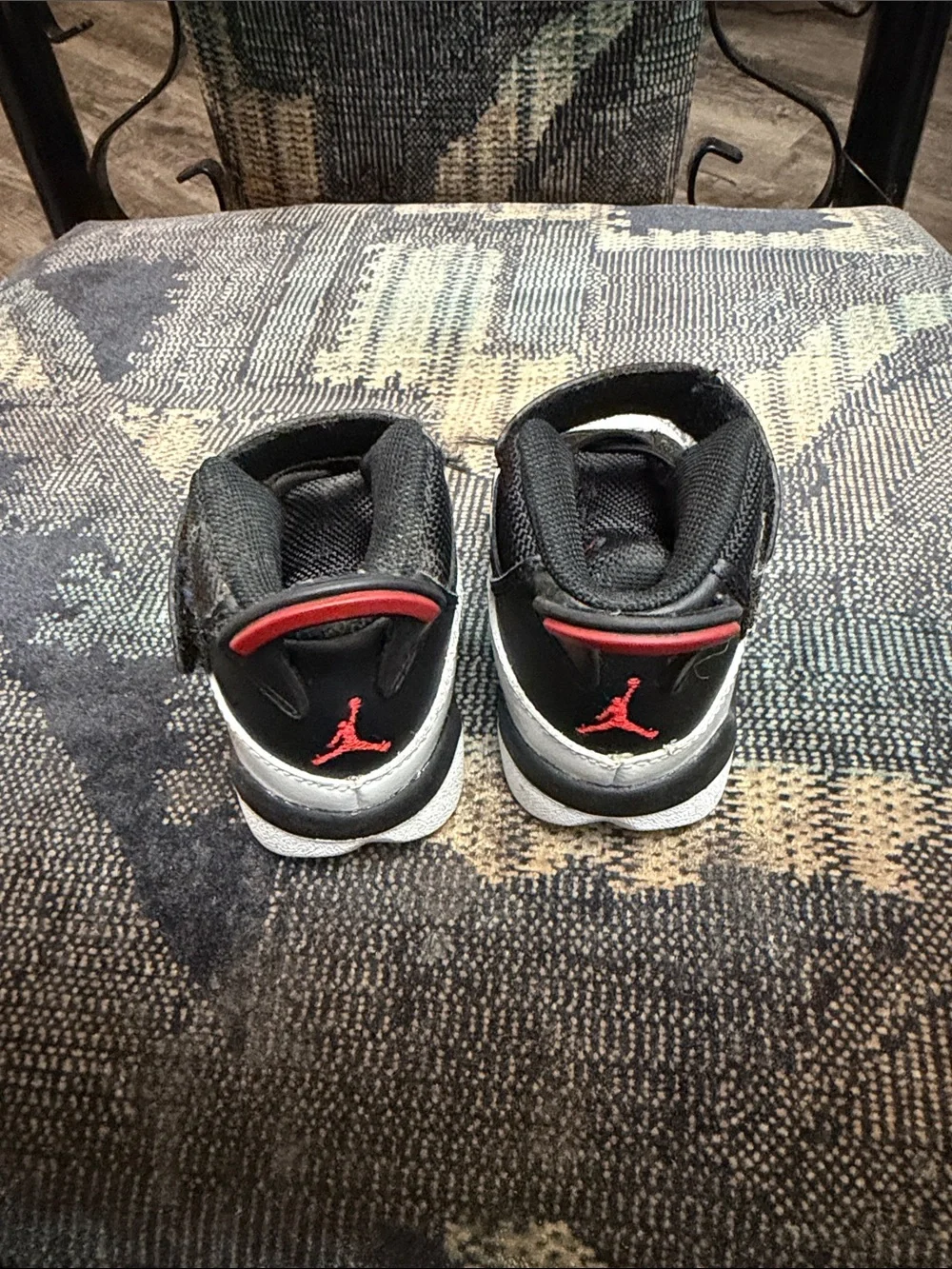 Jordan Kids Black and White High-Top Sneakers with Red Accent